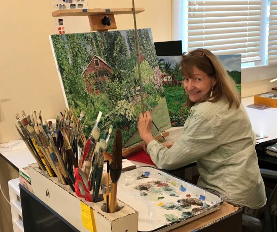 artist in studio painting