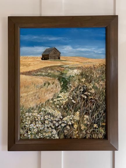 Framed painting of barn in field