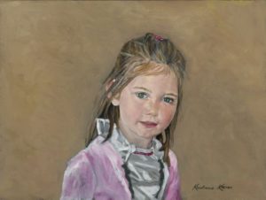 portrait of girl in pink coat in 3/4 view